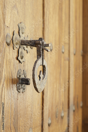 Detail of a gate latch on a wooden door
