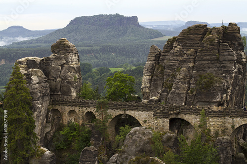 Landscape with rock massif and bridge