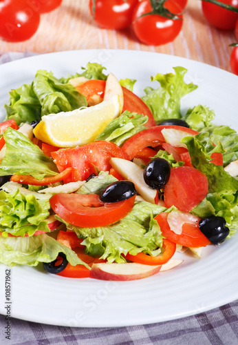 Fresh vegetable salad on the wooden table