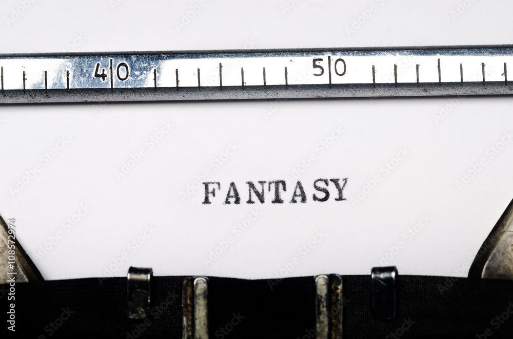 word fantasy typed on typewriter
