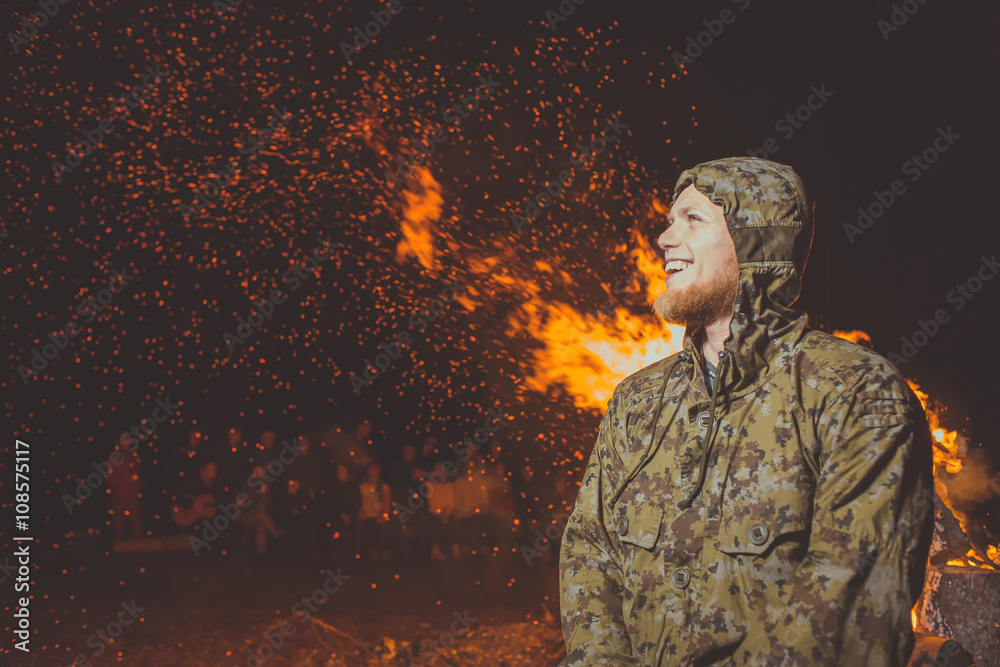 The portrait of the guy in the background sparks fire