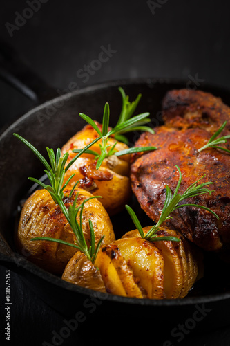 Pulled pork dish with backed rustic potates