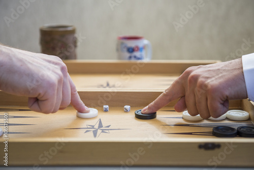 Two men play backgammon Fototapeta