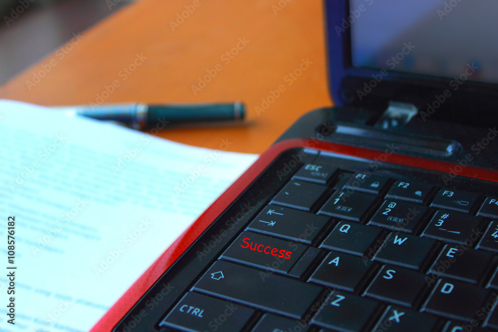 word written on a laptop keyboard that reads Success word written on a laptop keyboard that reads Success