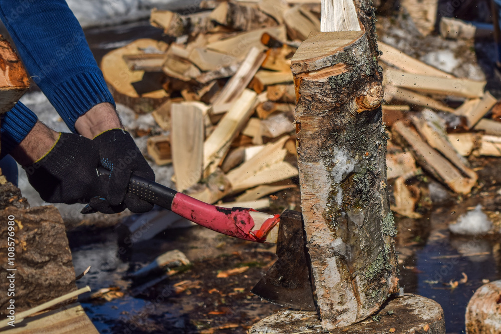 man with an ax chopping wood outdoors closeup man with an ax chopping wood outdoors closeup