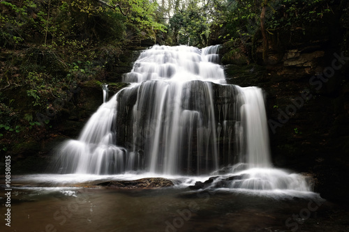 a big waterfall in forest in spring