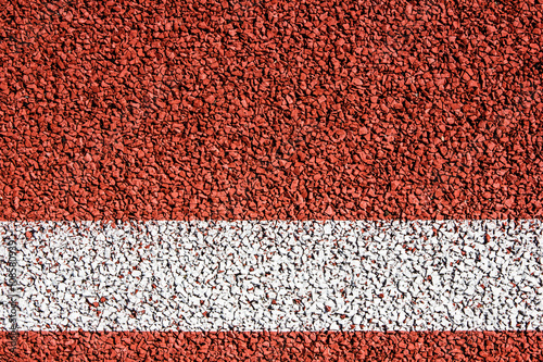 Running track with white line texture.