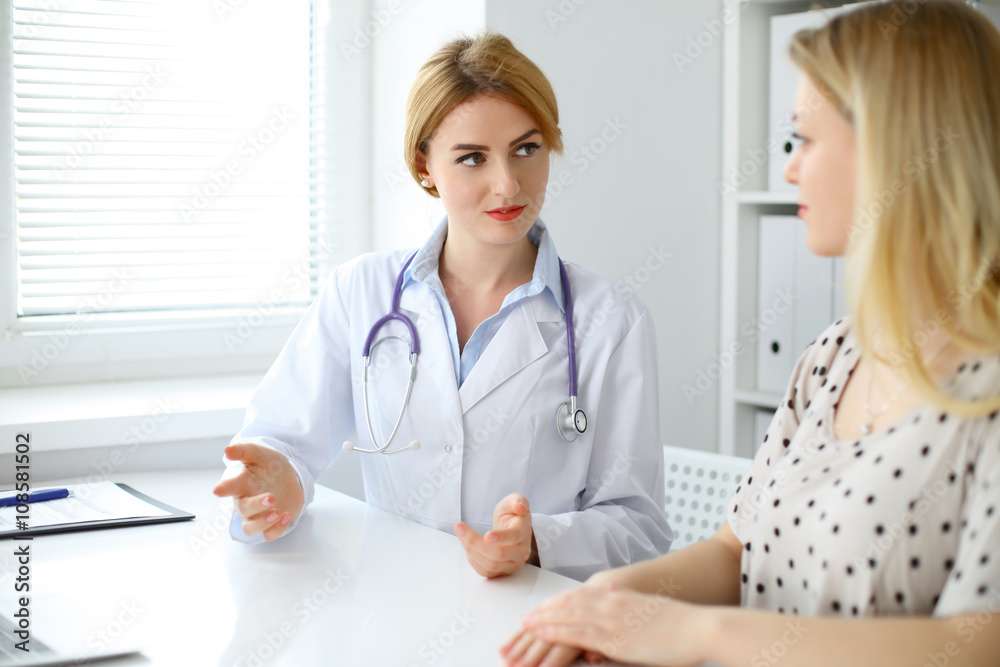 Doctor and patient are discussing something Doctor and patient are discussing something
