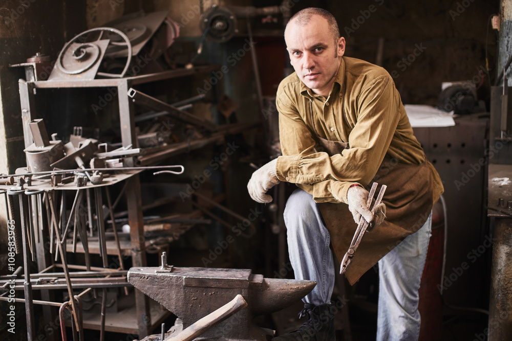 Portrait of a forge in the workshop