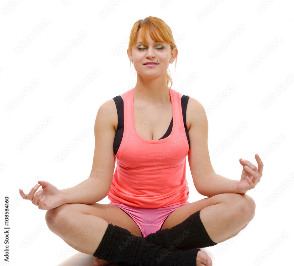 Portrait of a beautiful young woman sitting in yoga Portrait of a beautiful young woman sitting in yoga