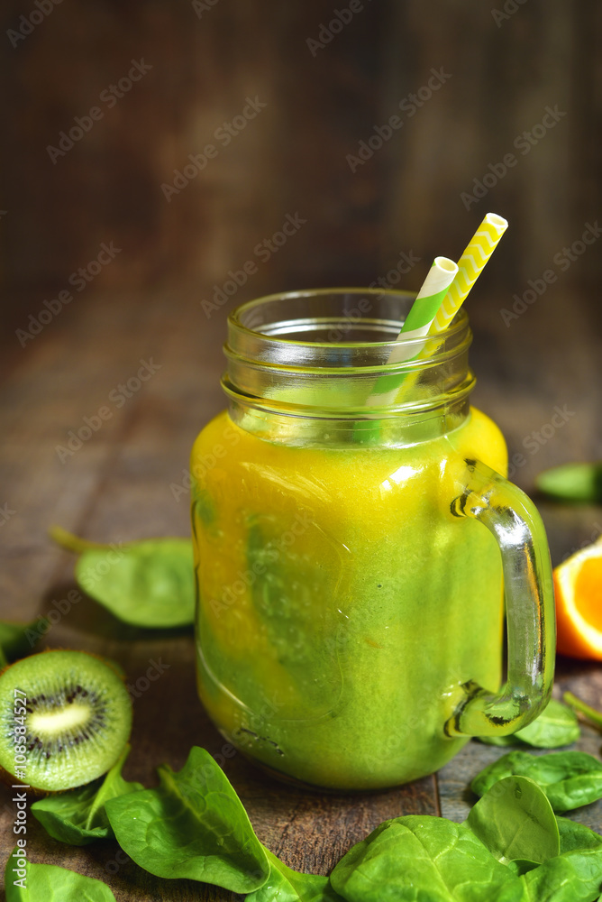 Two-coloured smoothie from spinach,kiwi and orange. Two-coloured smoothie from spinach,kiwi and orange.