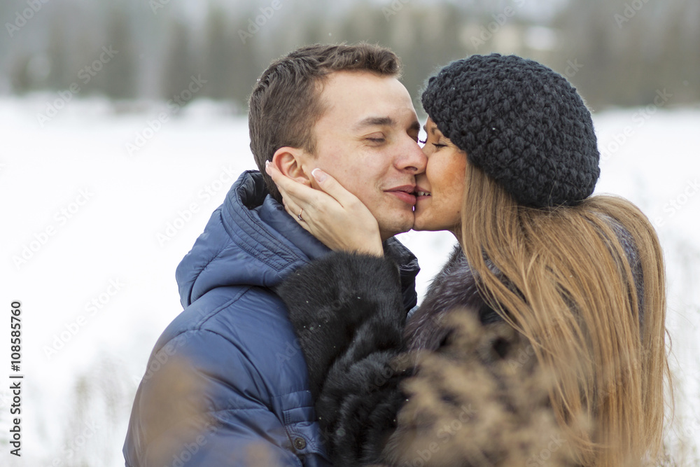 Happy Young Couple in Winter field