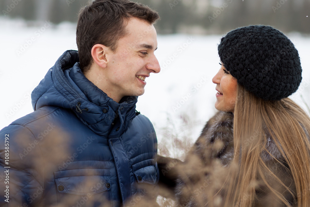 Happy Young Couple in Winter field Happy Young Couple in Winter field