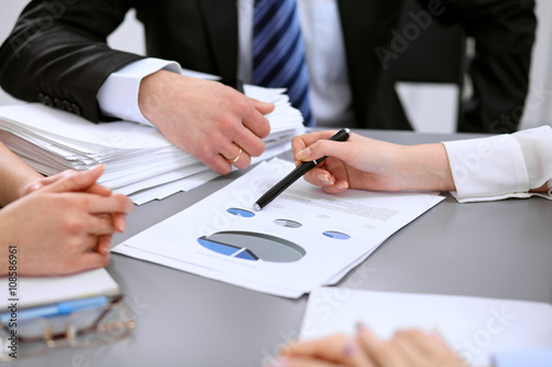 Close up of business people at meeting