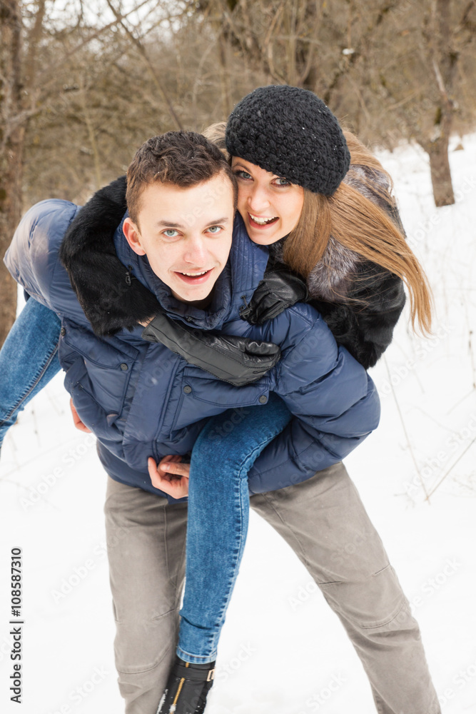 The young family plays winter wood on snow The young family plays winter wood on snow