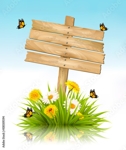 Summer nature background with grass, flowers and wooden sign. Ve