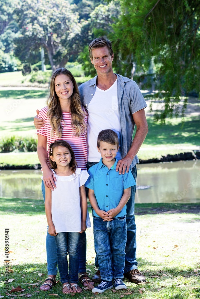 Happy family standing in the park Happy family standing in the park