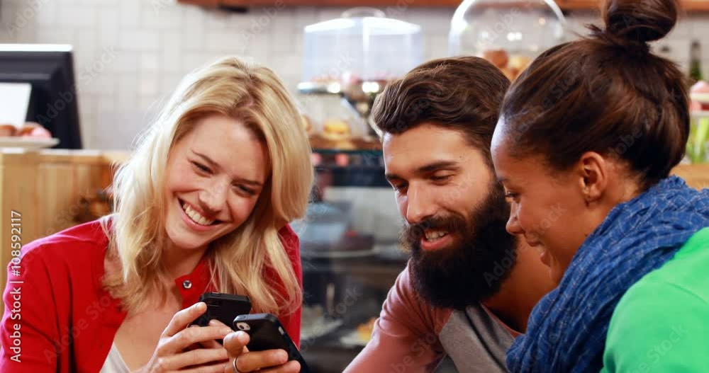 Hipster friends using smartphone Hipster friends using smartphone