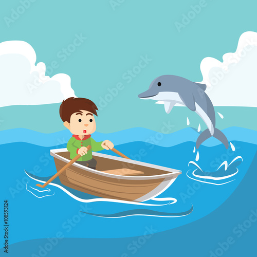Boy at sea with dolphin