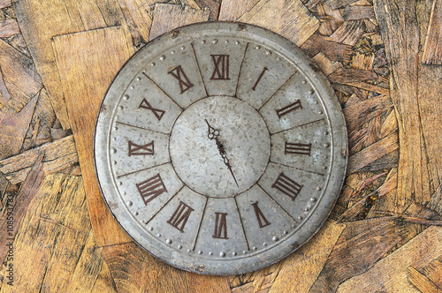 Wall clock old rusty grunge on wooden wall background, (with clipping path)