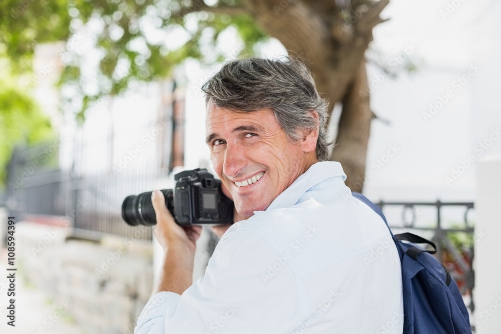 Rear view portrait of man using camera Rear view portrait of man using camera