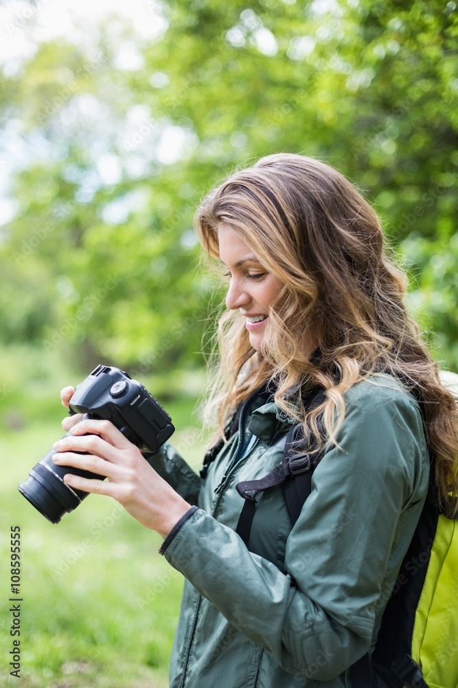 Young woman looking at camera in forest Young woman looking at camera in forest