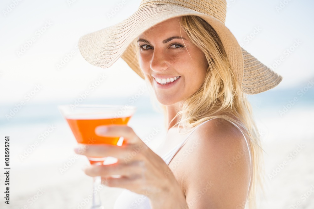 Blonde woman drinking cocktail Blonde woman drinking cocktail
