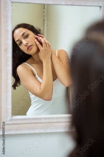 Woman popping her pimple