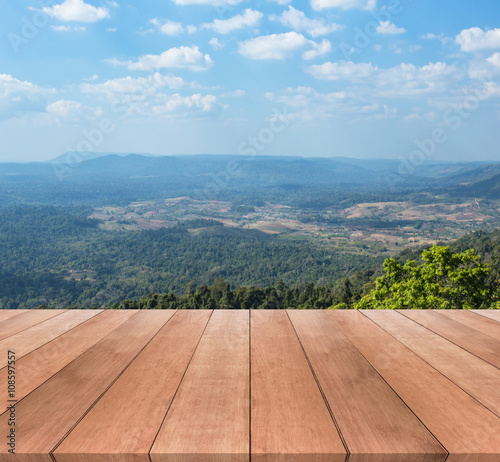 wood table top and sunny day with landscape background   © Thanakorn Thaneevej