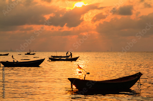 Fishing boats  small boats floating in the sea at sunrise  Conce
