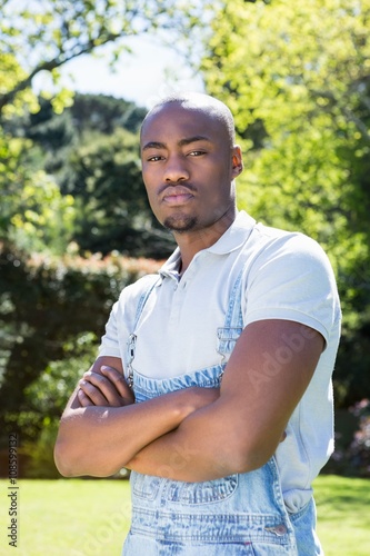 Young man standing in garden