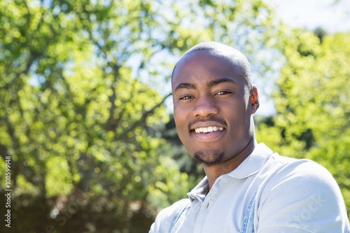 Young man standing in garden