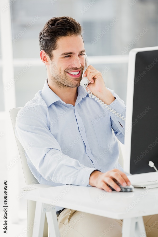 Fototapeta premium Businessman talking on phone
