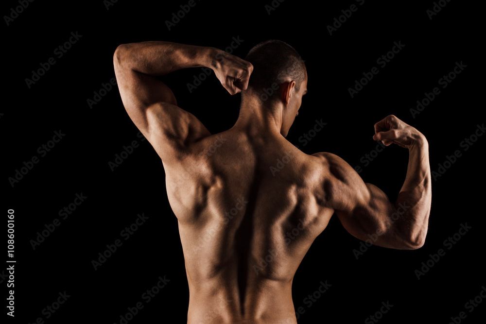 Sexy Athletic Man. Isolated on black background with copy space Sexy Athletic Man. Isolated on black background with copy space