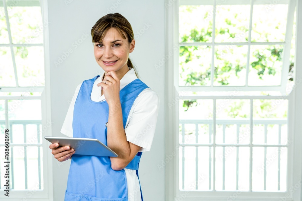 Portrait of smiling nurse holding digital tablet Portrait of smiling nurse holding digital tablet