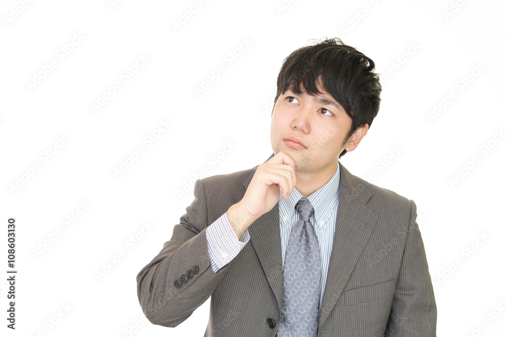 悩むビジネスマン