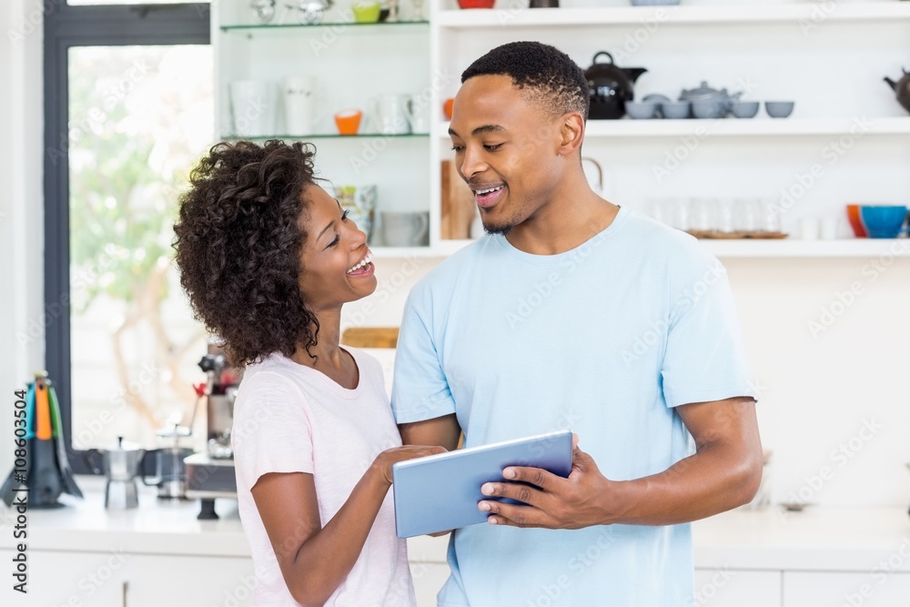 Happy couple using digital tablet Happy couple using digital tablet
