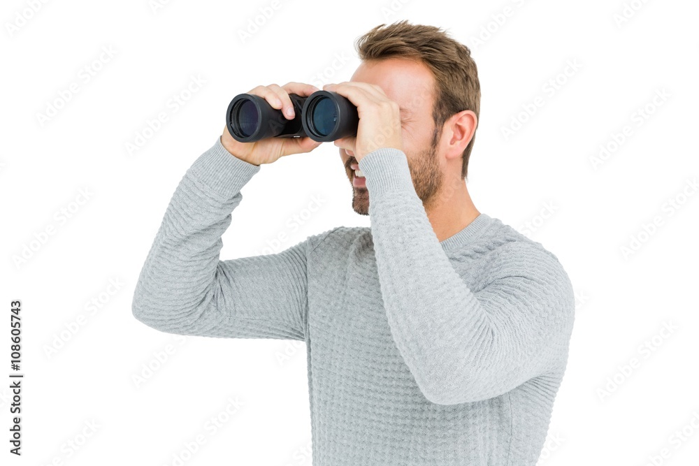 Young man looking through binocular Young man looking through binocular