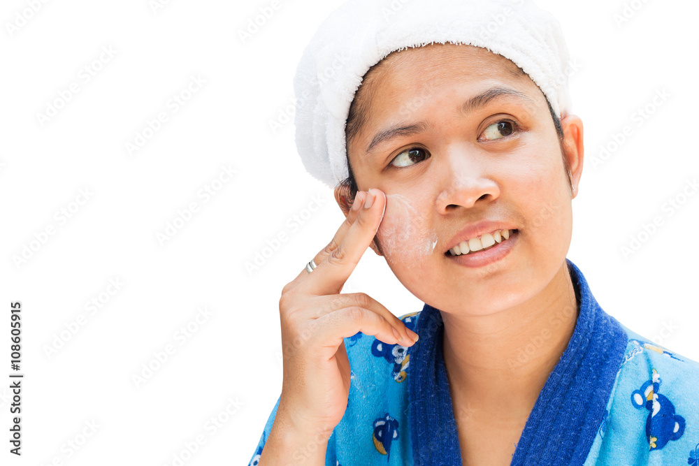 Woman applying moisturizer cream on her pretty face Woman applying moisturizer cream on her pretty face