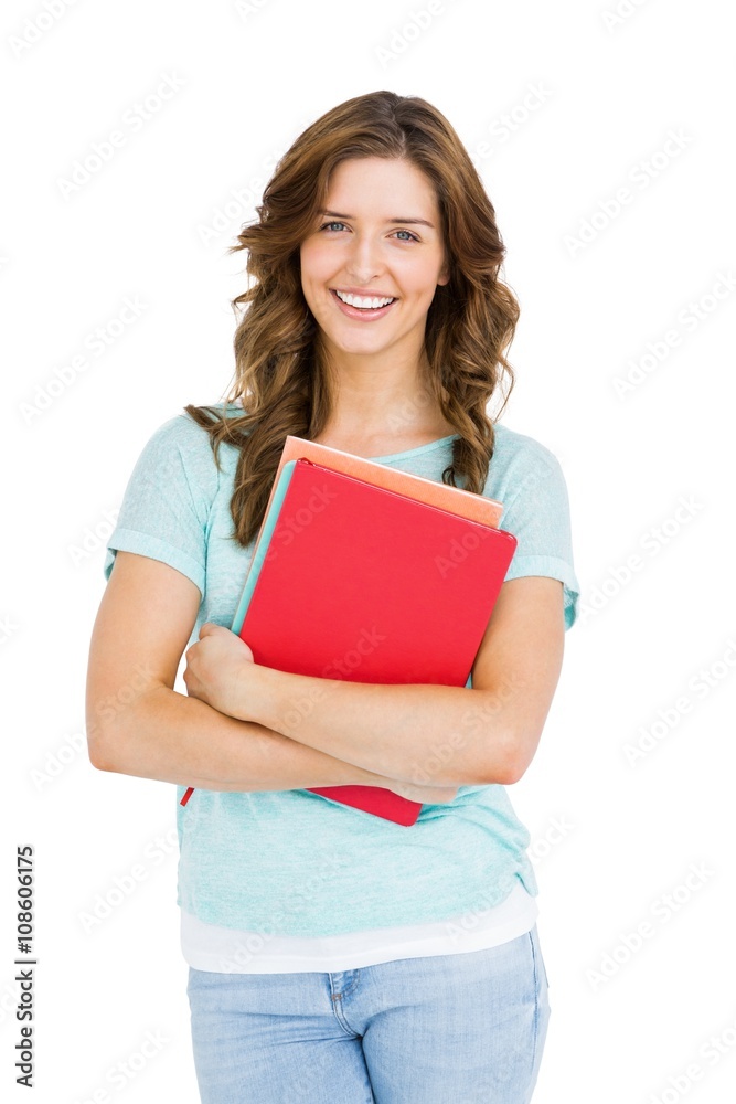Portrait of young woman holding books Portrait of young woman holding books