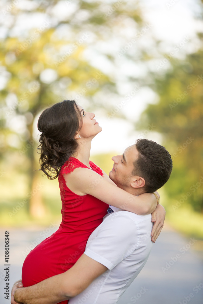 Happy young couple embrace in park Happy young couple embrace in park