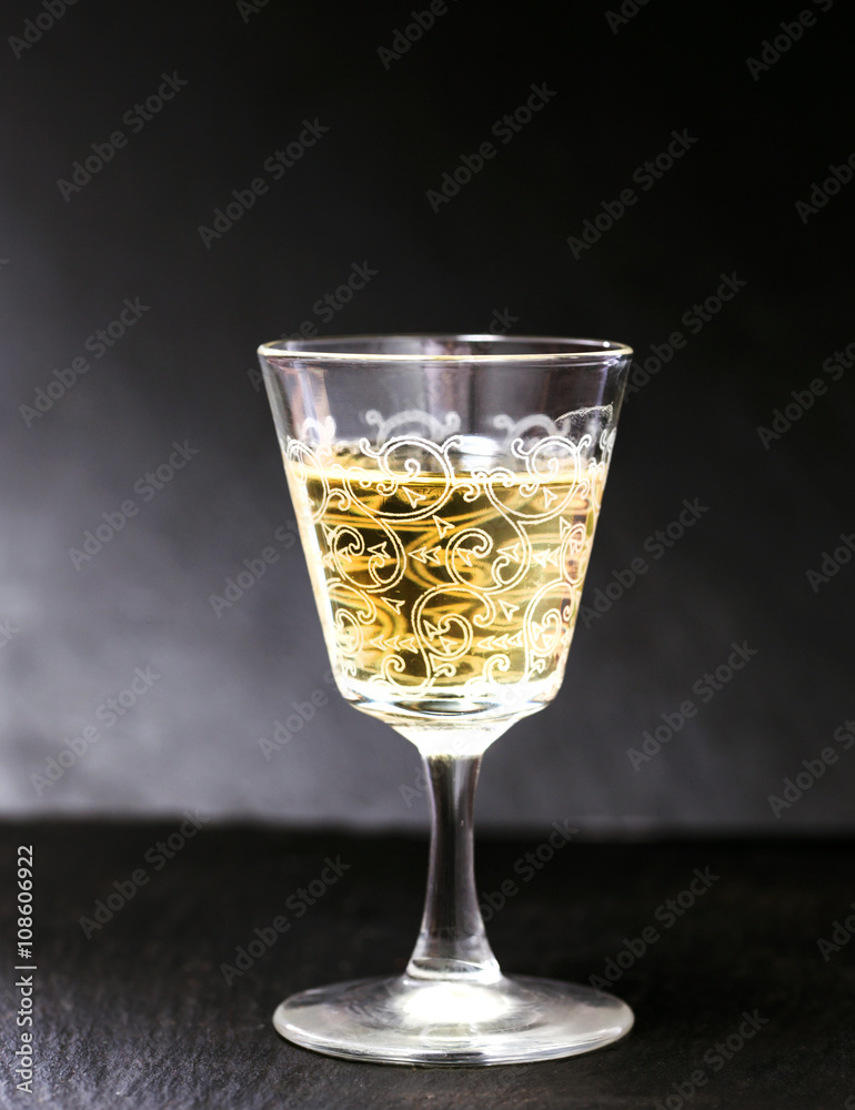 liquer glass over slate background liquer glass over slate background
