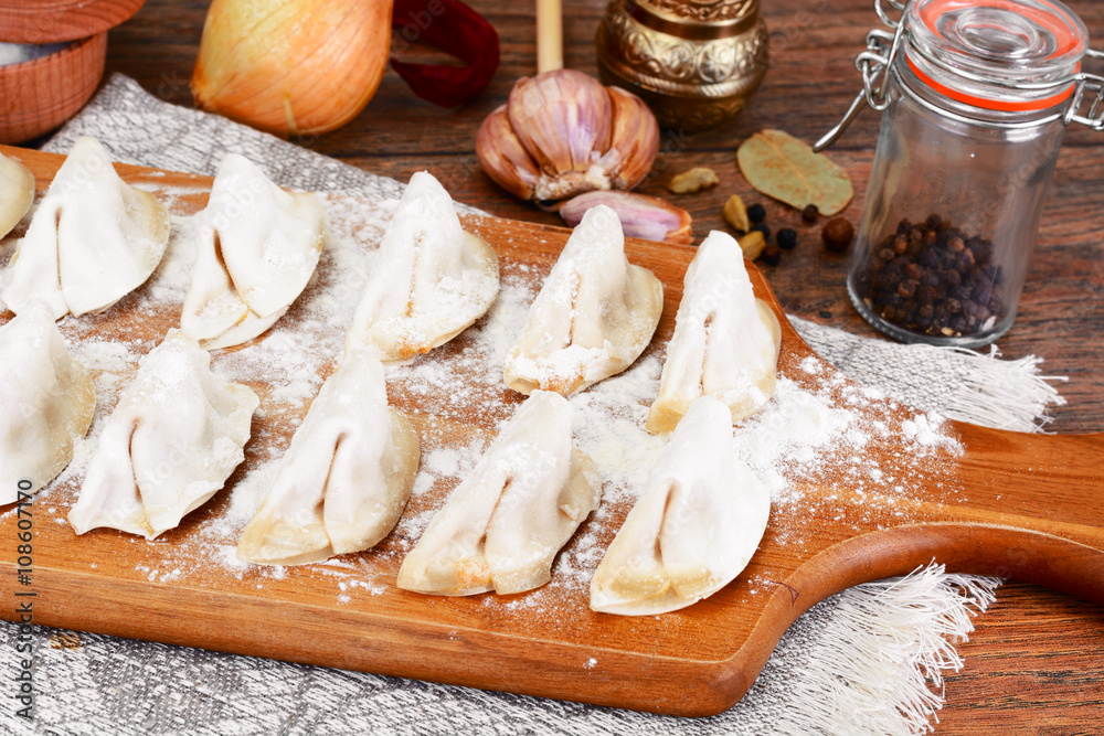 Fototapeta premium Raw Homemade Dumplings, Russian Pelmeni.