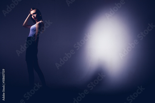 High fashion model posing in hat posing in light background © al1188