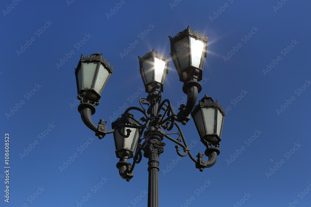 Decorative lamppost with blue background Decorative lamppost with blue background