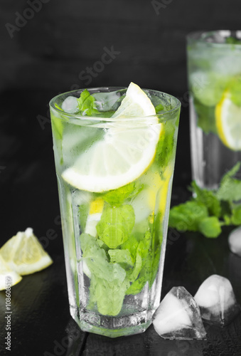 Lemonade in glass with mint, lemon and ice