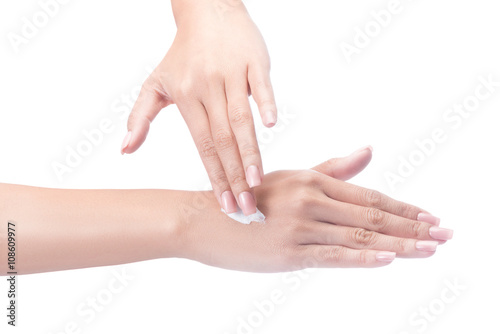 Beautiful young woman hands with cream  isolated on white with clipping path