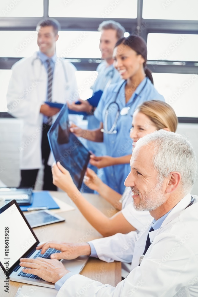 Medical team smiling in conference room Medical team smiling in conference room