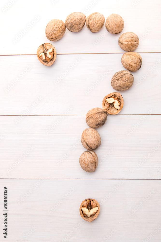 Nuts and question mark from walnut fruits Nuts and question mark from walnut fruits