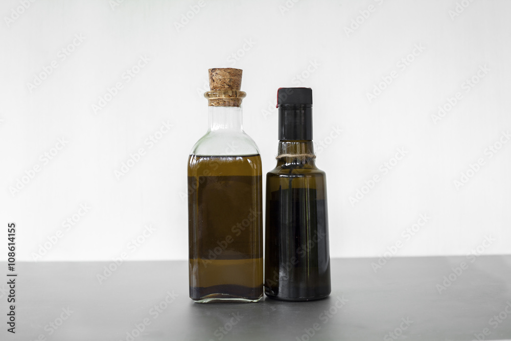Full shot oil in two glass containers isolated Full shot oil in two glass containers isolated